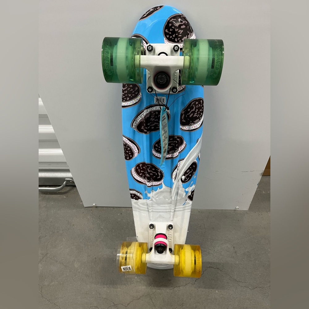 Blue and White Skateboard with Green and Yellow Wheels